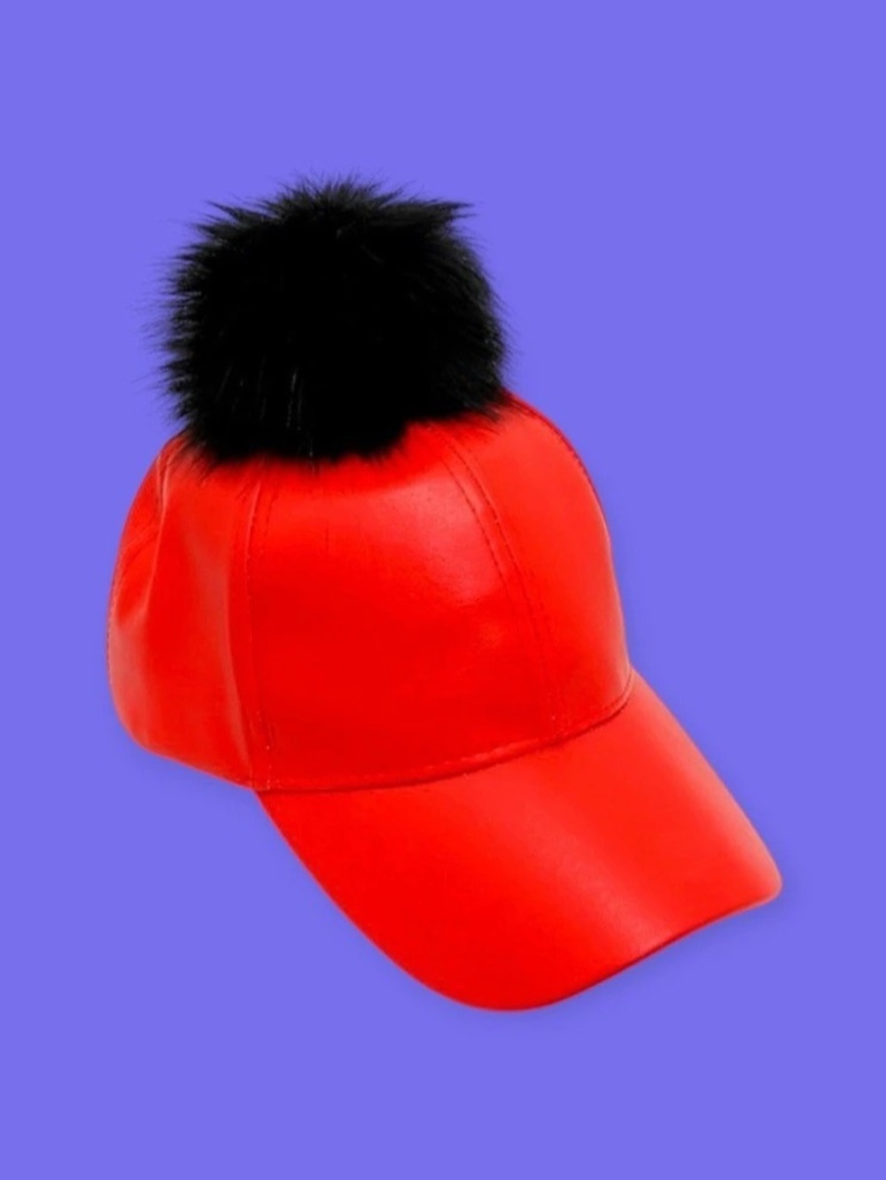 Baseball cap with a faux fur pom